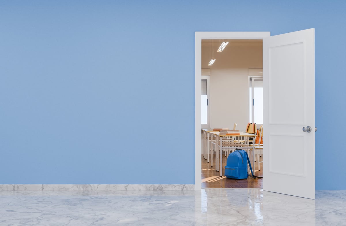 Open doorway looking into a finished room with marble-look flooring